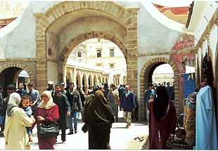 The Medina quarter in Essaouira, Morocco, showing women wearing the traditional Jilbāb.